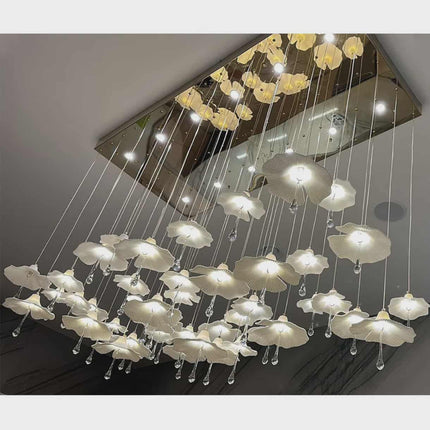 Ceiling-mounted chandelier with floral design on a gray ceiling