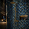 A luxury bathroom shower area featuring a wall covered in blue and gold fan-pattern mosaic tiles, with a brushed gold rain shower head and matching gold fixtures. A glass shower door is visible on the left, and a built-in niche with warm lighting sits on the right.