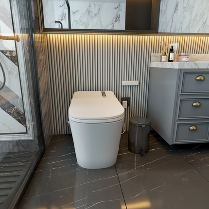 Modern bathroom with a toilet, sink, and vanity unit.