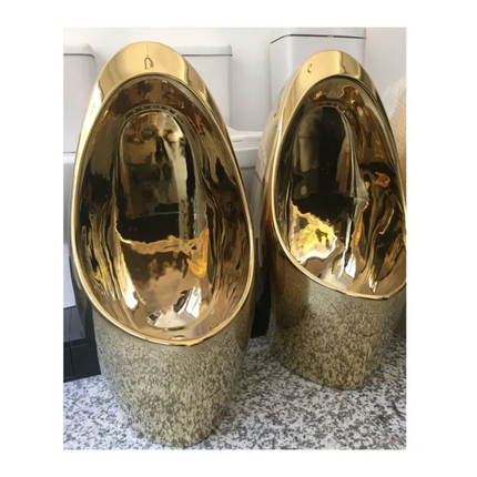 Two gold urinals on a white background