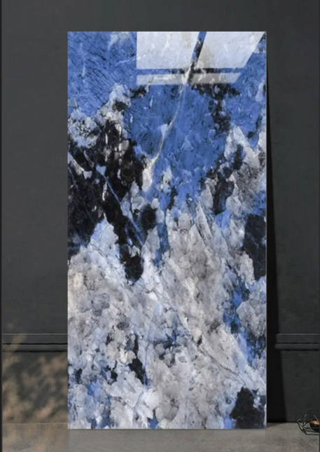 Marble slab with blue, gray, and black pattern on a dark background