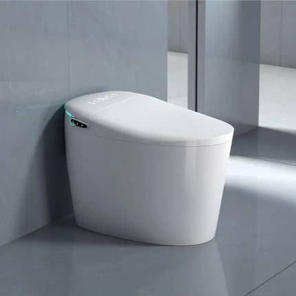 Modern white toilet bowl in a bathroom setting with gray tiles.