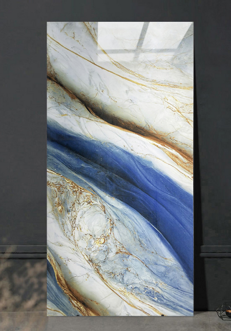 Marble-patterned wall art with blue and gold tones on a dark background