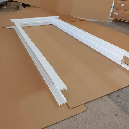 White frame on brown cardboard in a warehouse setting