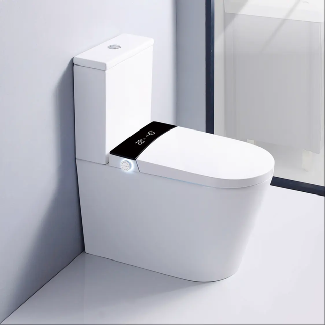 Modern white toilet in a bathroom setting with a sleek design.