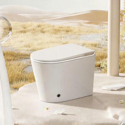 White toilet bowl in a natural setting with grass and water.