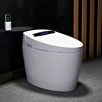 Modern white toilet with digital display in a bathroom setting
