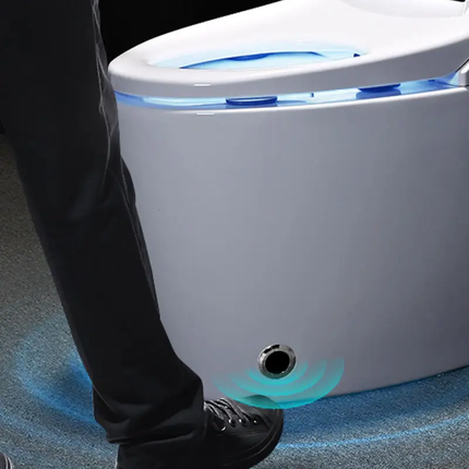 Smart toilet with a person's foot approaching, indicating sensor technology.