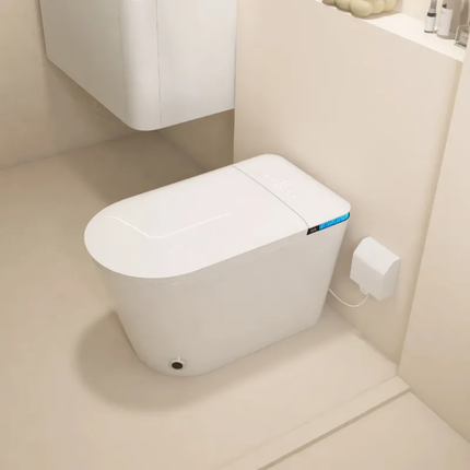 Modern toilet with additional device attached in a bathroom setting