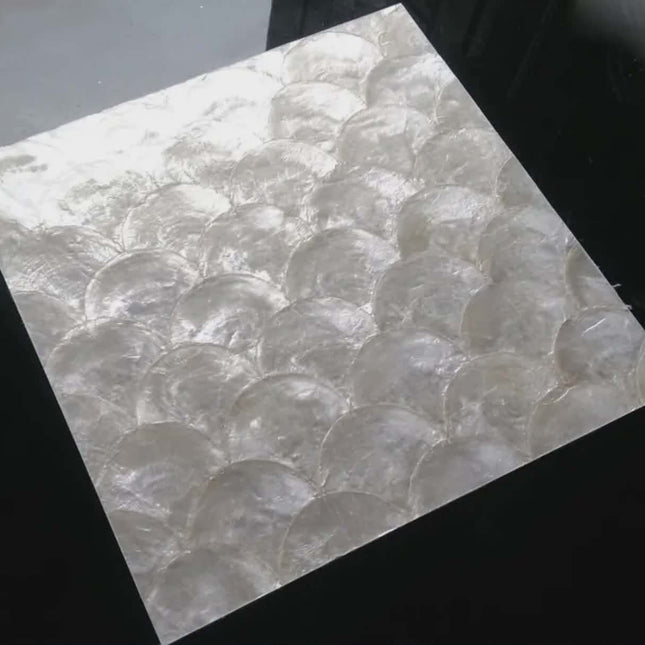 Tile with a circular pattern on a black background