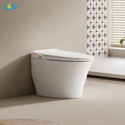 Modern toilet in a bathroom with a decorative wall and window blinds.