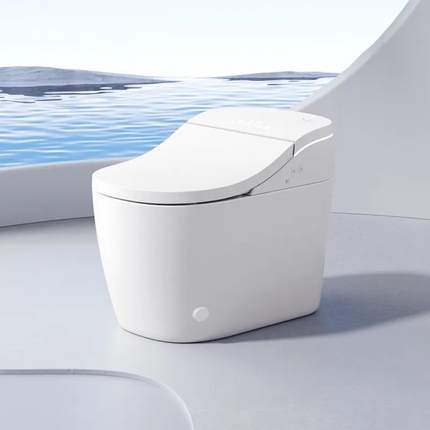 White toilet bowl with a lid on a light gray surface, with water in the background