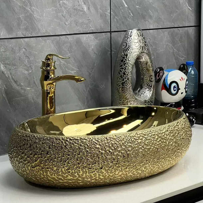 Modernes, luxuriöses, ovales Waschbecken aus goldenem Porzellan – Elegantes Aufsatzwaschbecken