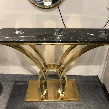 Modern Gold Electroplated Display Table Marvel A Sculptural Console Table Made with Stainless Steel  Featuring a Luxurious Black Marble Top