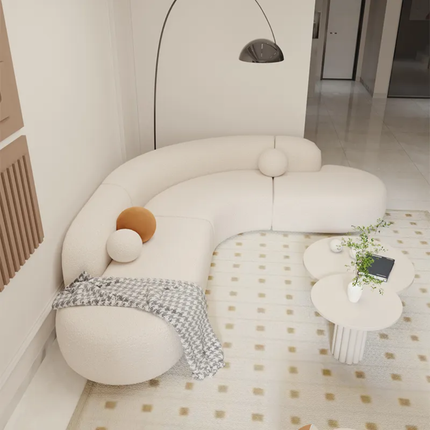 Modern living room with a unique white sofa and decorative elements.