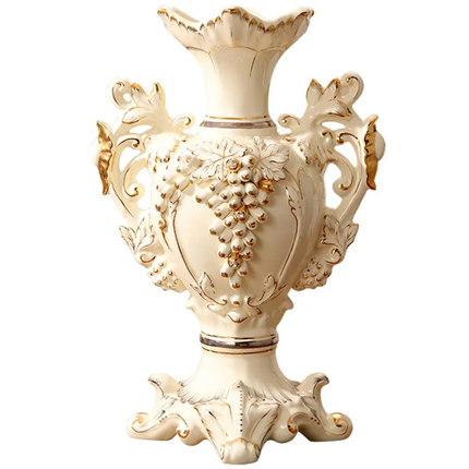 Decorative cream-colored vase with intricate gold designs on a white background