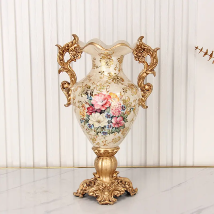 Decorative vase with floral design and gold accents on a white background