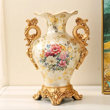 Decorative vase with floral design and gold accents on a white surface.