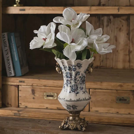 Decorative vase with floral arrangement on a wooden shelf