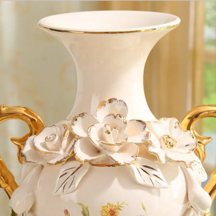 Decorative vase with floral designs and gold accents on a blurred background