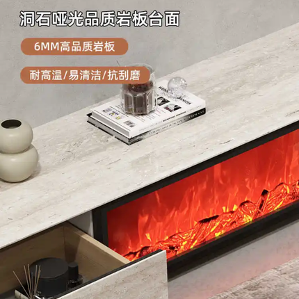 Modern kitchen counter with electric fireplace, books, and a vase on a gray background