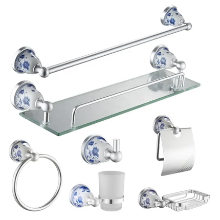 Bathroom accessory set with glass shelf, towel bar, and other fixtures on a white background