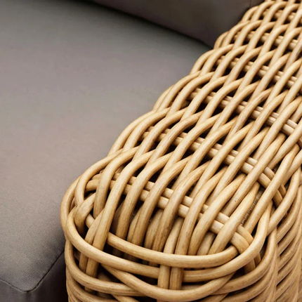 Close-up of a woven rattan basket on a gray surface