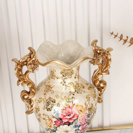Decorative vase with floral patterns and gold accents against a white curtain background