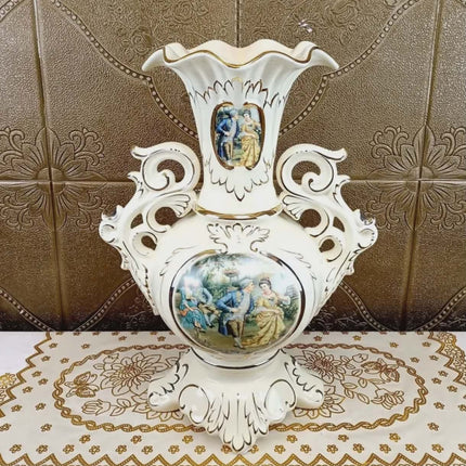 Decorative white vase with artistic designs on a patterned surface