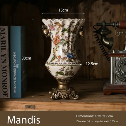 Decorative vase with floral patterns on a wooden shelf, shown with measurements and the brand 'Mandis'.