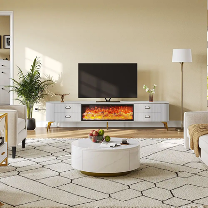 Modern living room with a white entertainment console, TV, and round coffee table.