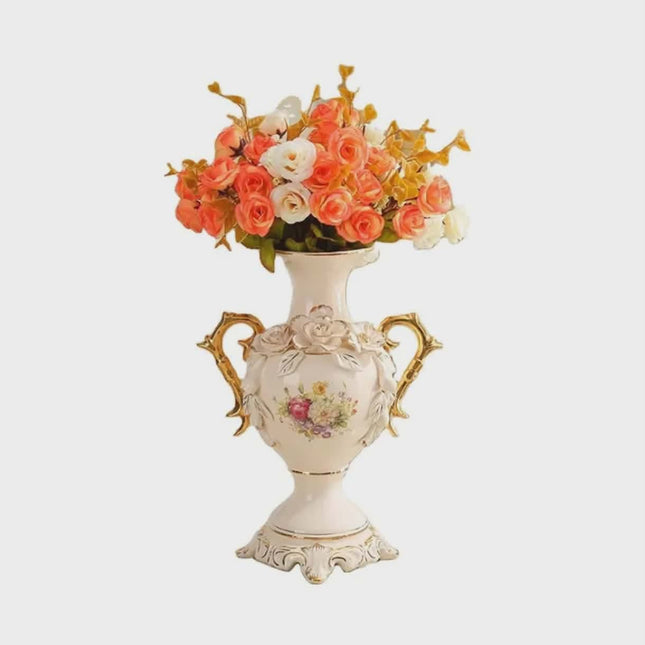 Decorative vase with floral design and handles on a white background