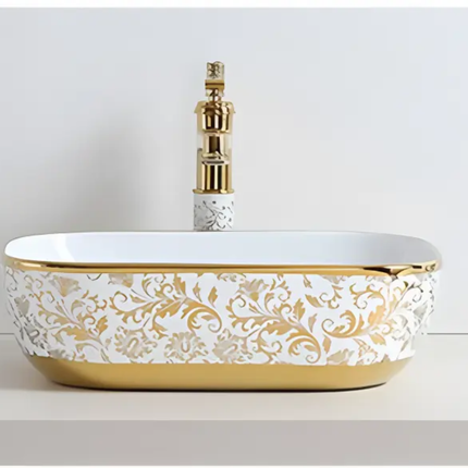 Decorative bathroom sink with gold and white pattern on a light background