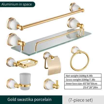 Gold and white bathroom accessory set with swastika design on a white background
