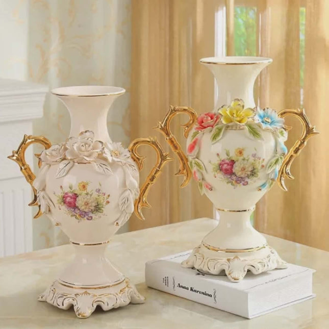 Two decorative vases with floral designs on a table.