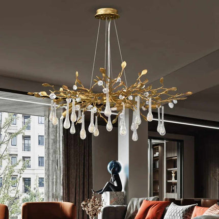Golden Dewdrop Illumination A Sculptural Chandelier with Crystal Pendants and Gilded Branches Illuminating Elegance and Natural Charm Soft Light Dances Through Delicate Forms Casting a Warm and Inviting Glow