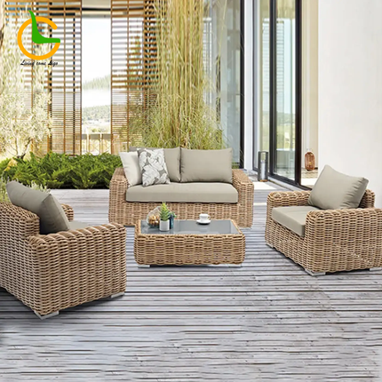 Outdoor patio furniture set on a wooden deck with a modern building in the background.