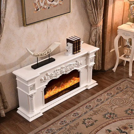 Decorative white fireplace with electric fire in a room with a rug and side table.