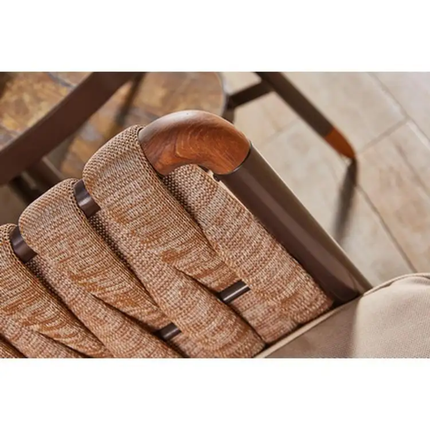 Close-up of a textured brown armrest with wooden armrest on a chair.