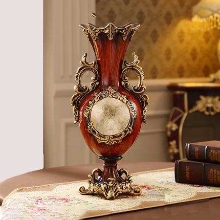 Decorative vase with intricate designs on a table in an elegant room.