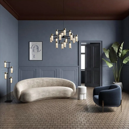Modern living room with a beige sofa, blue armchair, and decorative elements.