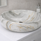 Marble-patterned sink on a bathroom counter with a neutral background

porcelain countertop sink
marble pattern bathroom sink
tabletop porcelain basin
bathroom cabinet sink
luxury bathroom wash basin
electroplated porcelain sink
modern countertop bathroom basin
marble design bathroom sink
vanity countertop wash basin