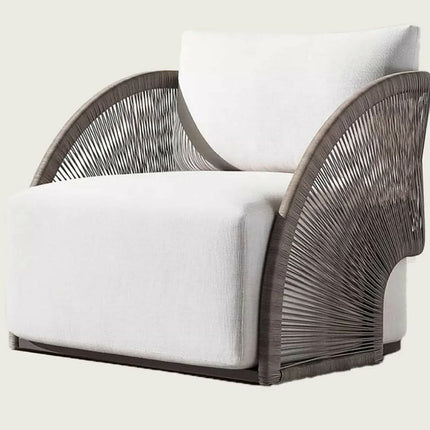 Modern armchair with white cushion and wicker backrest on a light background