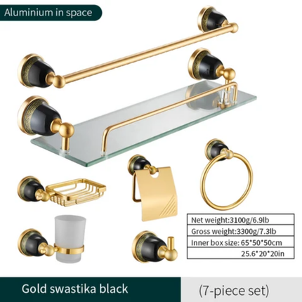Bathroom accessory set with gold and black swastika design on a white background