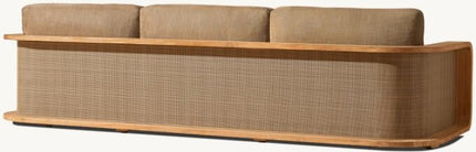 Long, narrow sofa with woven backrest and wooden frame on a white background