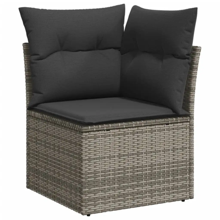 Wicker outdoor corner seat with black cushions on a white background