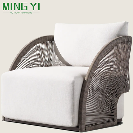 White armchair with wicker backrest on a light background, featuring the brand 'MING YI'.