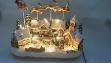 Load and play video in Gallery viewer, Christmas Village Santa and Reindeer Sounds and Lights With Charger Polyresin
