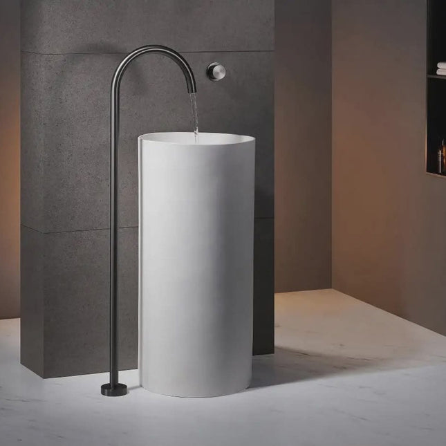 Minimalist Freestanding Round Bathroom Sink with Matte Black Floor Faucet and Modern Concrete Wall Backdrop