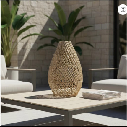 Sunlit Woven Rattan Vase on Minimalist Outdoor Coffee Table
